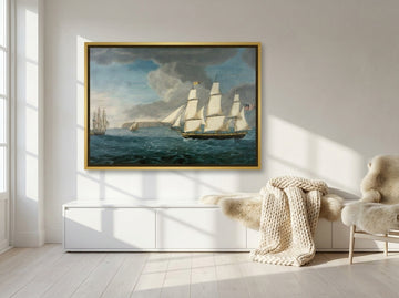 Canvas wall art with a gold leaf surround styled on the wall in a bright Scandinavian living room