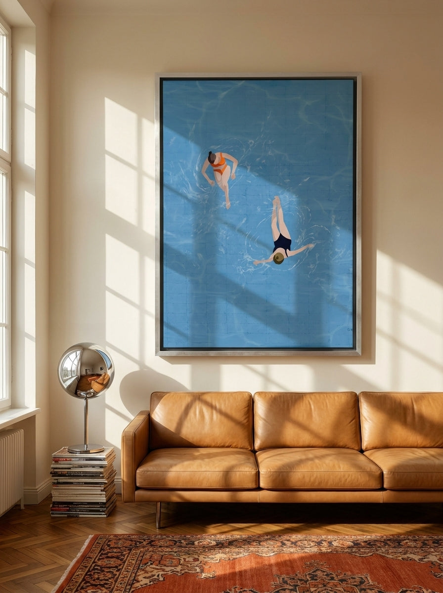 Oversized statement canvas wall art with a silver leaf surround styled on the wall in a retro 70s living room
