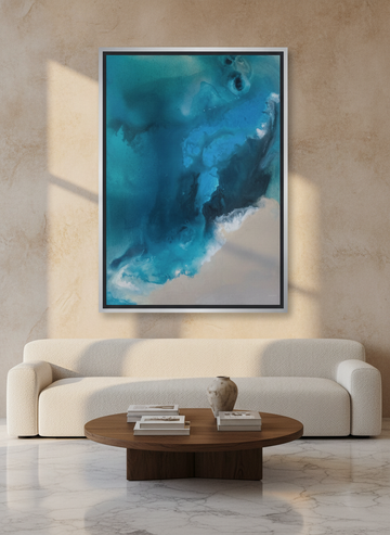 Oversized statement canvas wall art with a silver leaf surround styled on the wall in a luxe living room