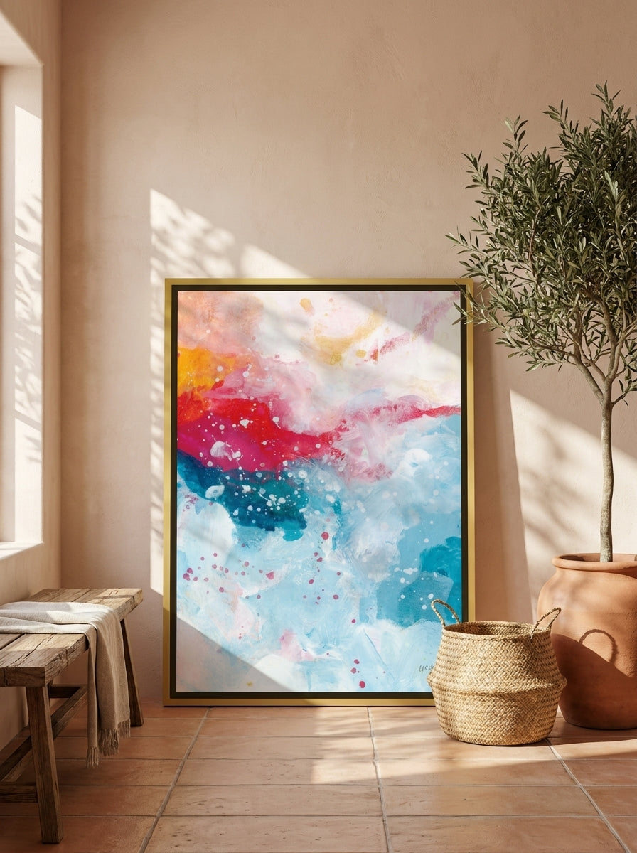 Canvas wall art with a gold leaf surround leaning against the wall in a Mediterranean dining room