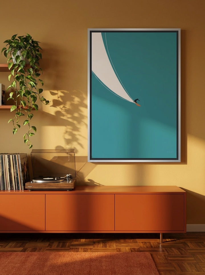 Canvas wall art with a silver leaf surround styled on the wall in a retro 70s living room
