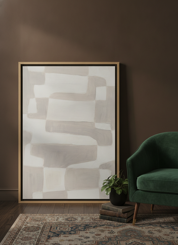 Canvas wall art with a natural timber surround leaning against the wall in a moody bedroom