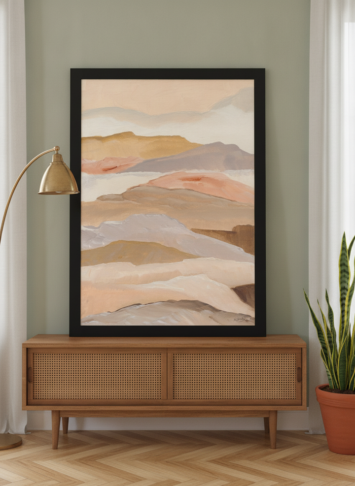 Modern wall art print standing on a sideboard in a mid-century living room