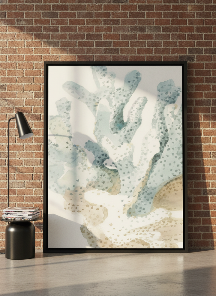 Oversized statement canvas wall art with a black surround leaning against the wall in an industrial loft living room
