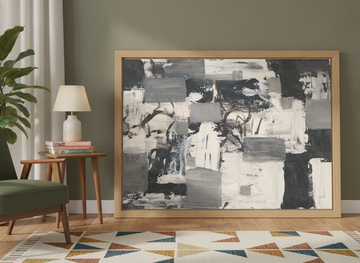 Modern wall art print leaning against the wall in a mid-century bedroom