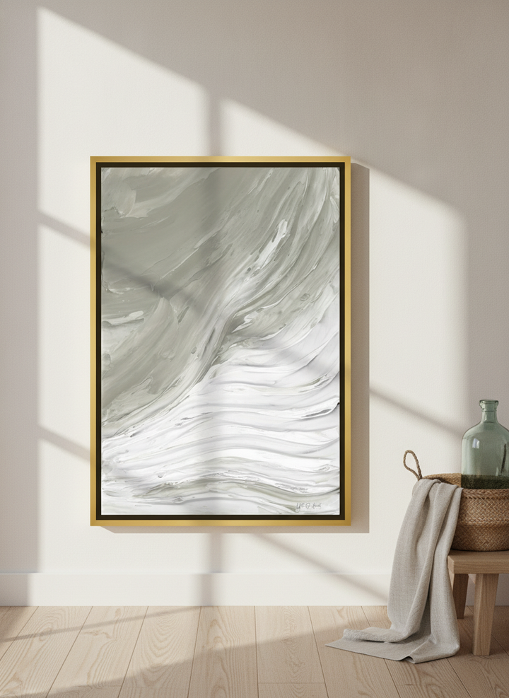 Canvas wall art with a gold leaf surround leaning against the wall in a coastal home office