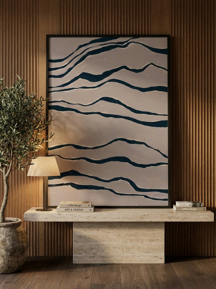 Modern wall art print standing on a console in a luxe dining room
