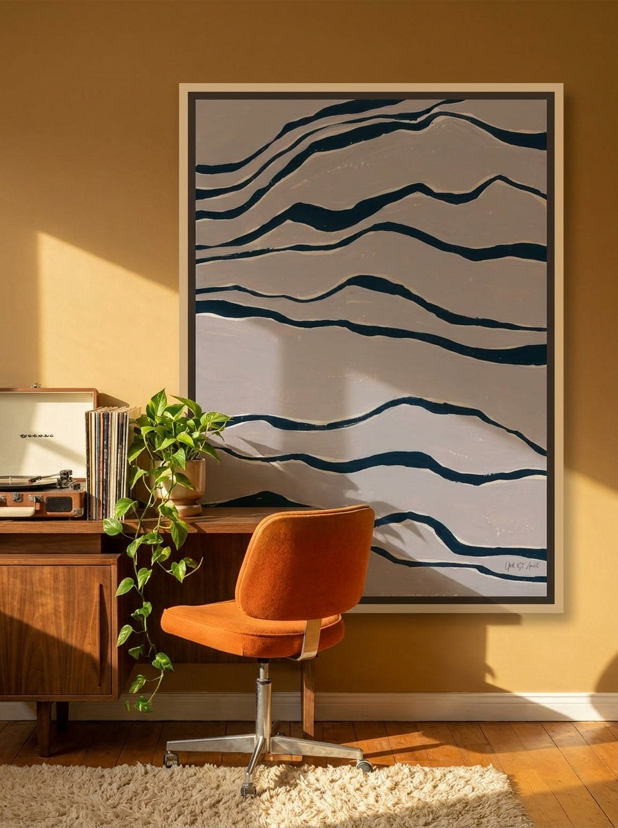 Canvas wall art with a natural timber surround styled on the wall in a retro 70s home office