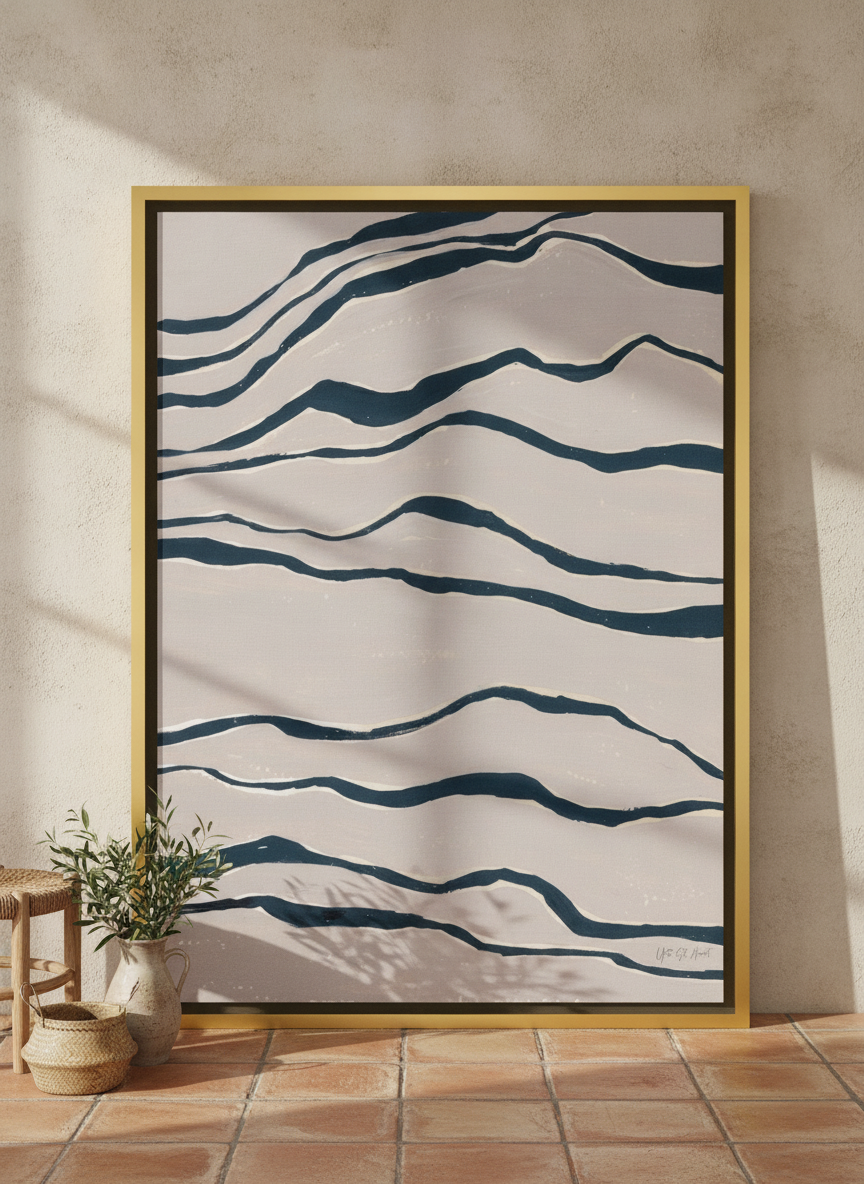 Oversized statement canvas wall art with a gold leaf surround leaning against the wall in a Mediterranean living room