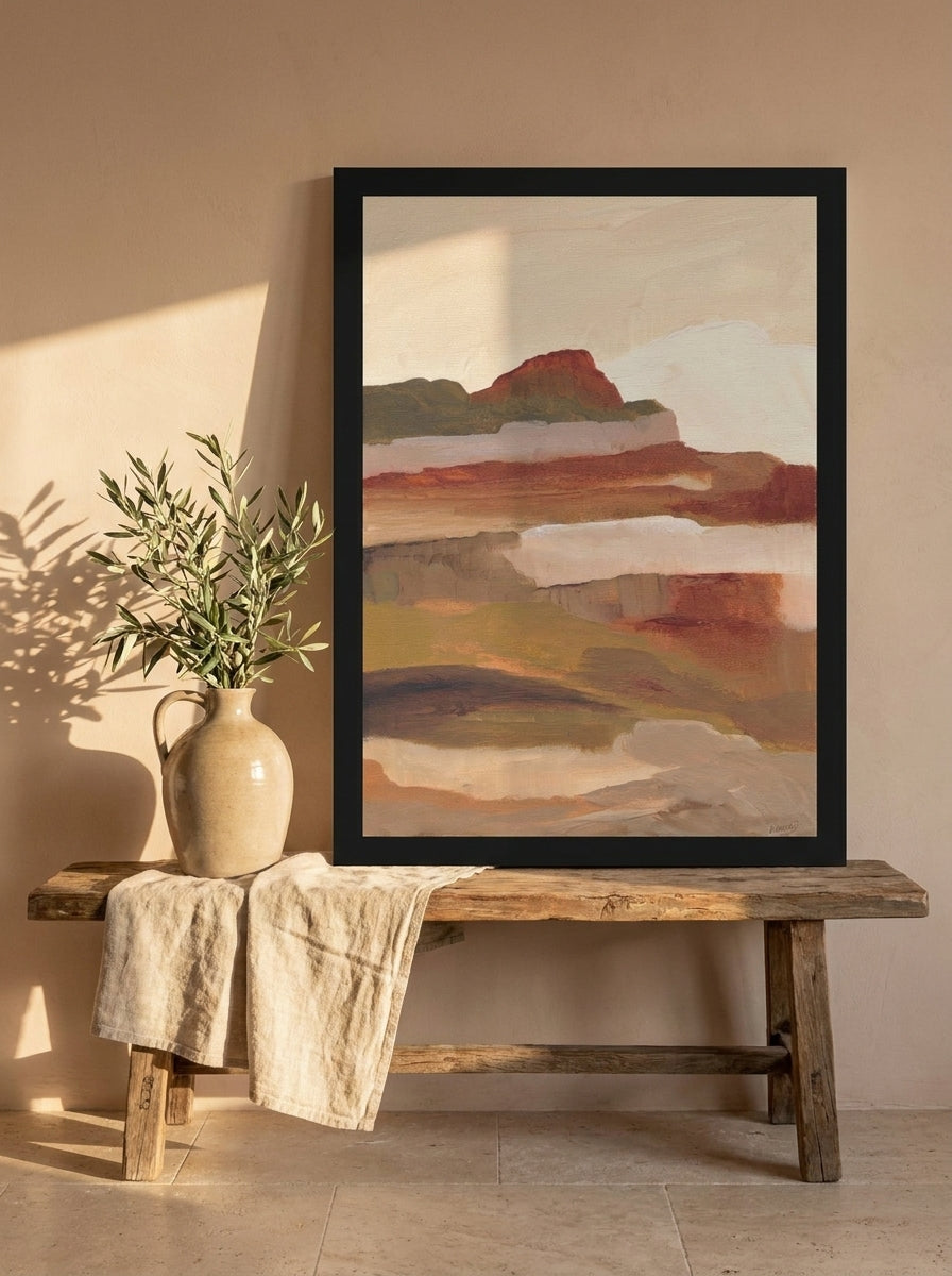 Modern wall art print standing on a bench in a Mediterranean bedroom
