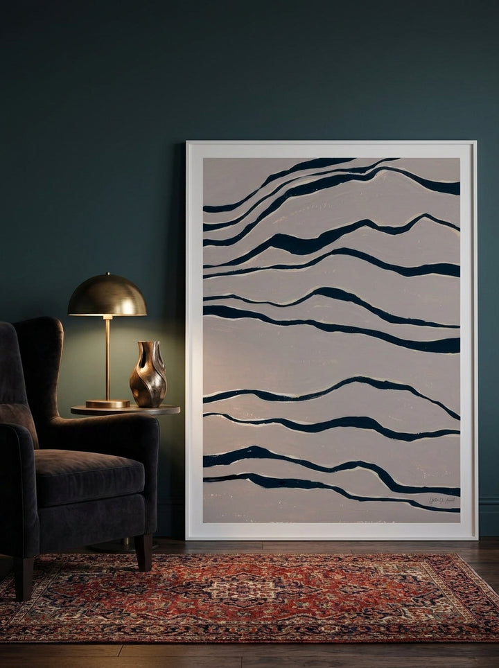 Oversized statement modern wall art print leaning against the wall in a moody living room