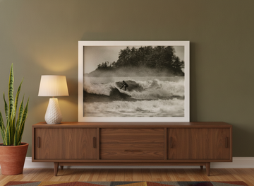 Modern wall art print standing on a sideboard in a mid-century home office
