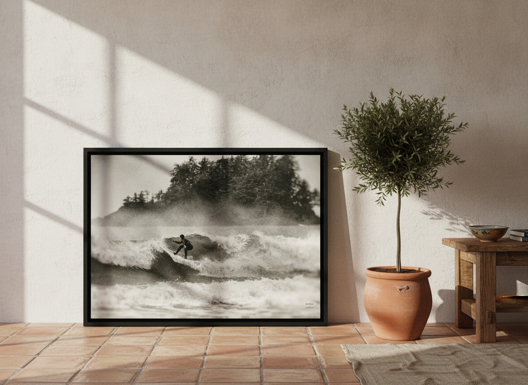 Canvas wall art with a black surround leaning against the wall in a Mediterranean bedroom
