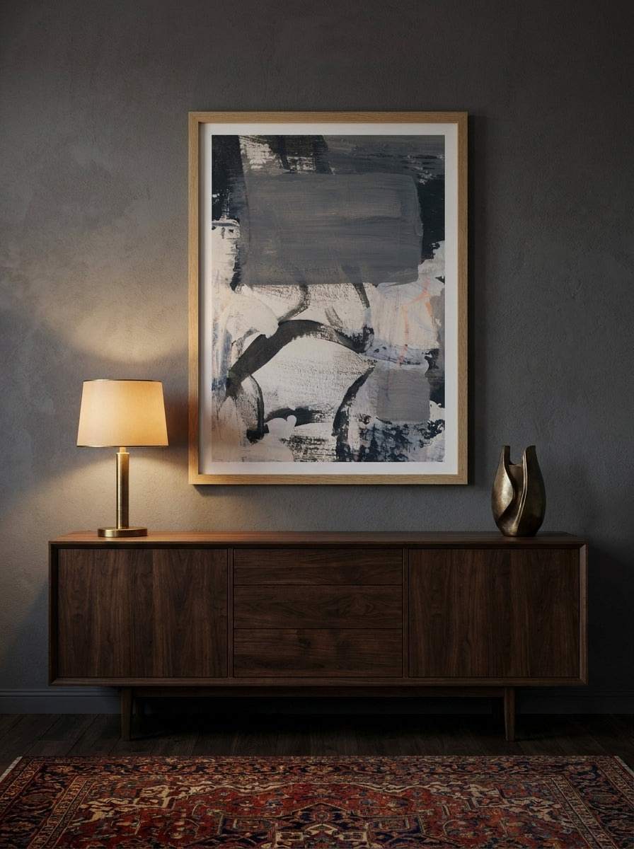 Modern wall art print styled on the wall in a moody living room