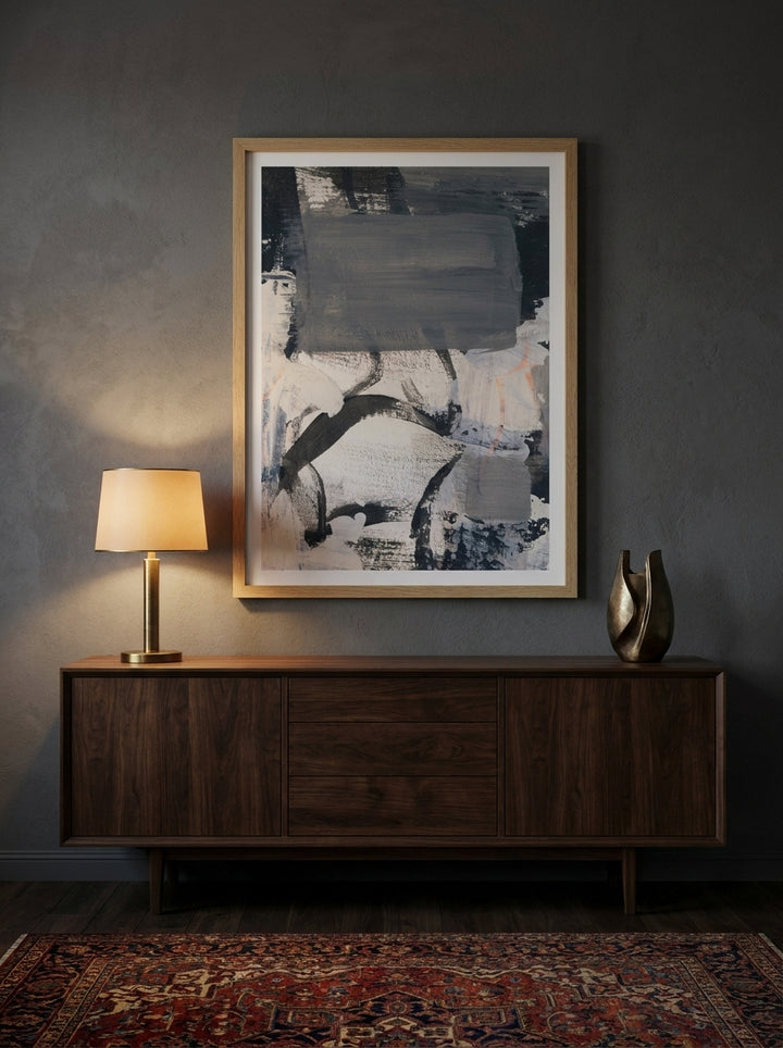 Modern wall art print styled on the wall in a moody living room