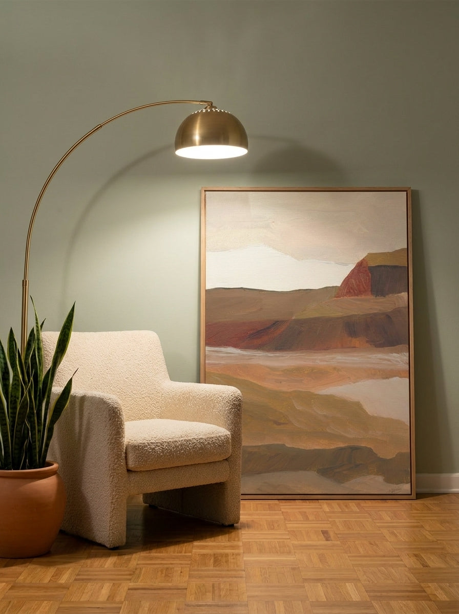 Oversized statement modern wall art print leaning against the wall in a mid-century dining room