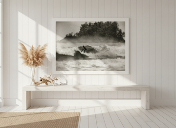 Modern wall art print standing on a console in a coastal dining room