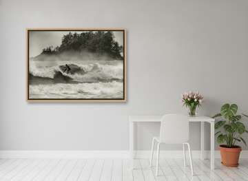 Canvas wall art with a natural timber surround styled on the wall in a bright Scandinavian home office