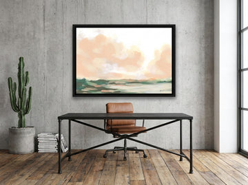 Canvas wall art with a black surround styled on the wall in an industrial loft home office