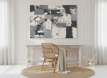 Stretched canvas wall art styled on the wall in a coastal home office