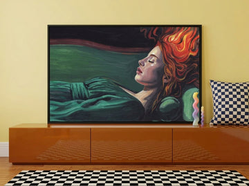 Canvas wall art with a black surround standing on a sideboard in a colourful eclectic dining room