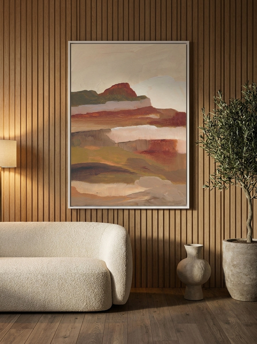 Canvas wall art with a white surround styled on the wall in a luxe living room