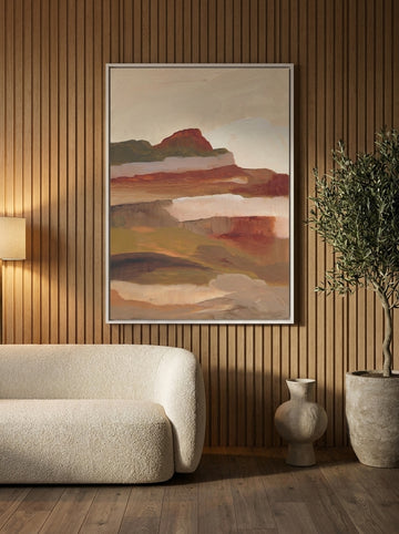 Canvas wall art with a white surround styled on the wall in a luxe living room