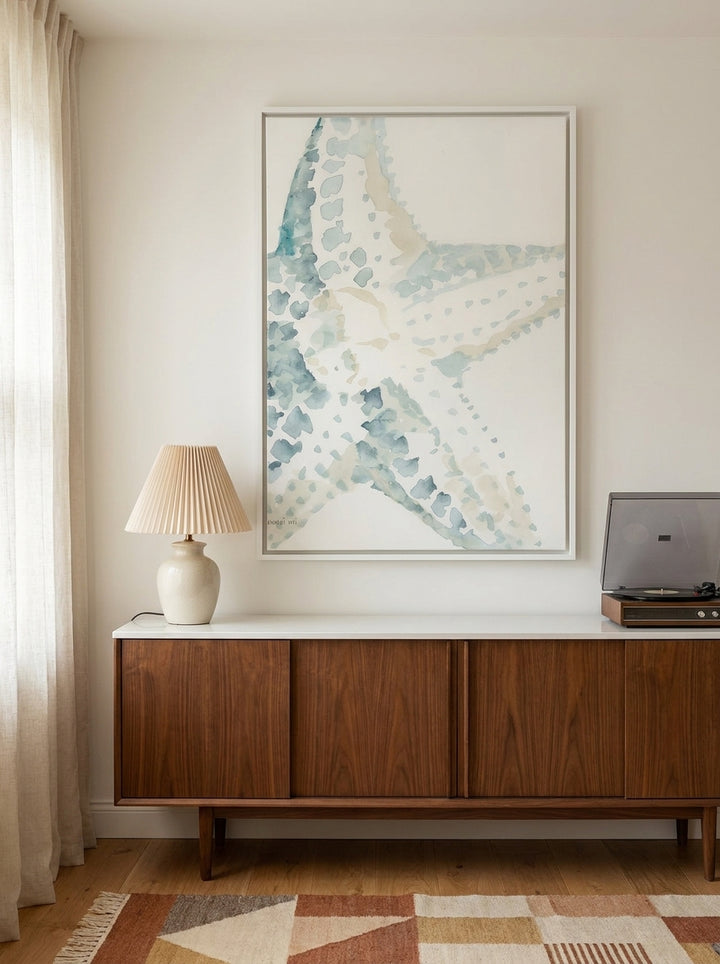 Canvas wall art with a white surround styled on the wall in a mid-century kitchen