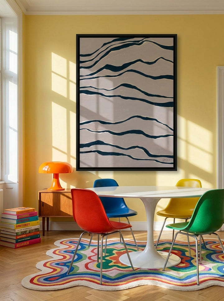 Oversized statement canvas wall art with a black surround styled on the wall in a colourful eclectic dining room
