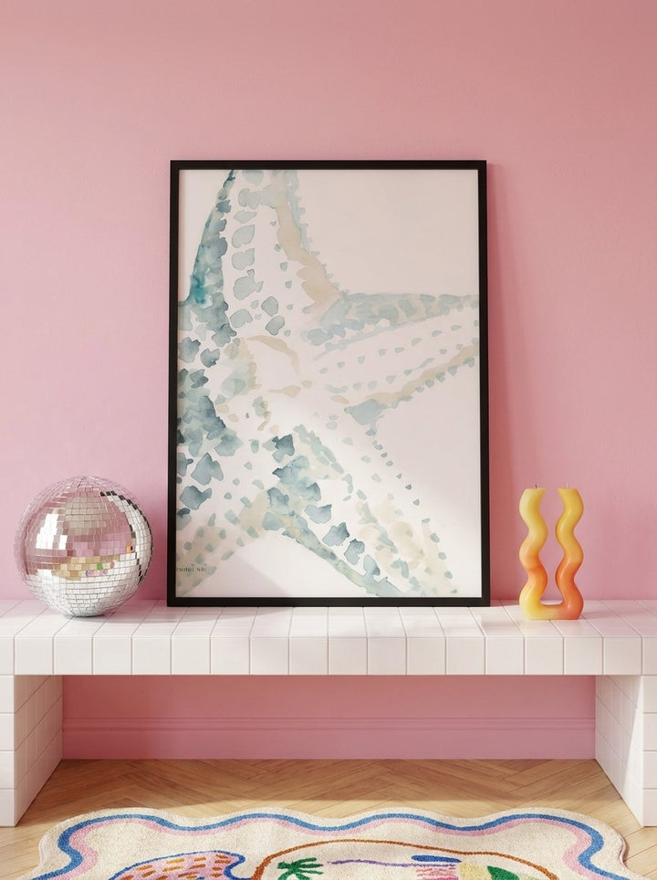 Modern wall art print standing on a kitchen bench in a colourful eclectic kitchen