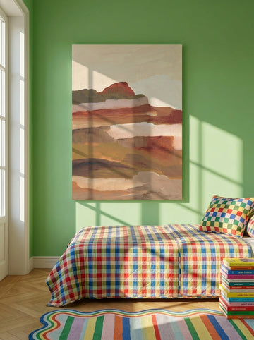 Stretched canvas wall art styled on the wall in a colourful eclectic bedroom