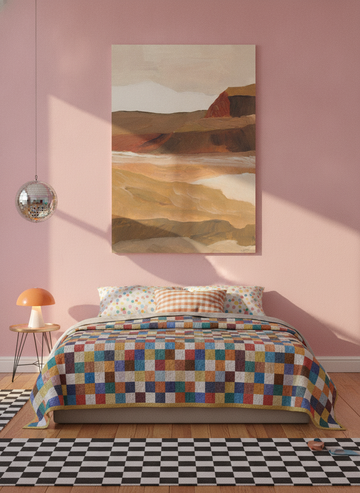 Stretched canvas wall art styled on the wall in a colourful eclectic bedroom
