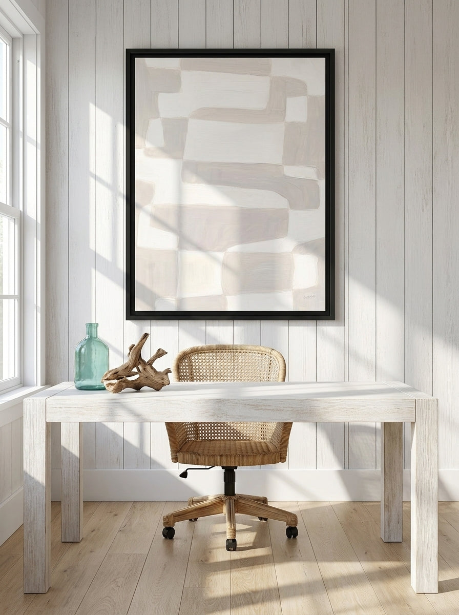 Canvas wall art with a black surround styled on the wall in a coastal home office