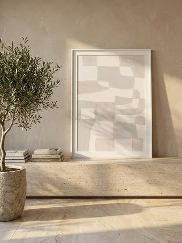 Modern wall art print standing on a console in a luxe home office