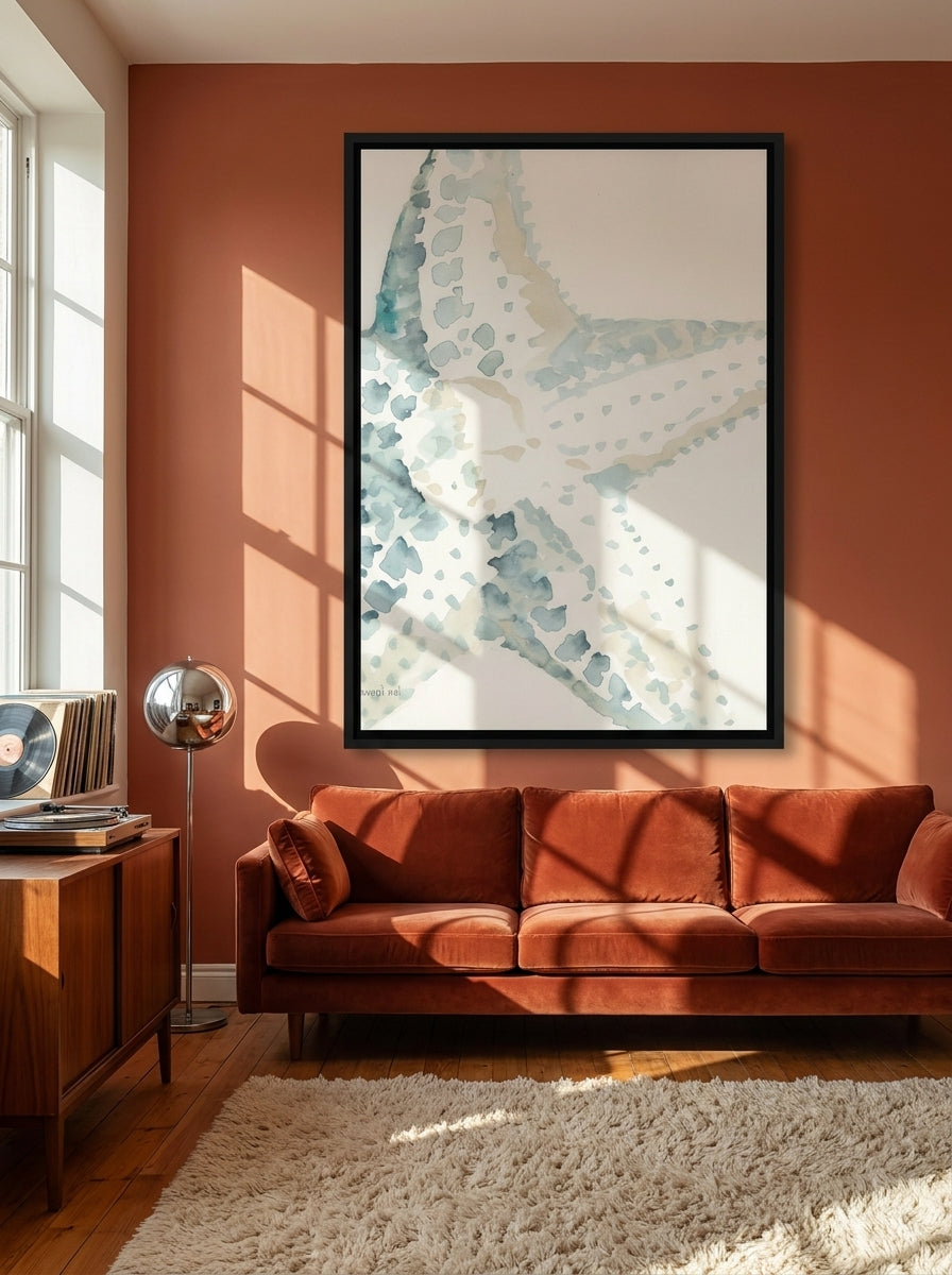 Oversized statement canvas wall art with a black surround styled on the wall in a retro 70s living room