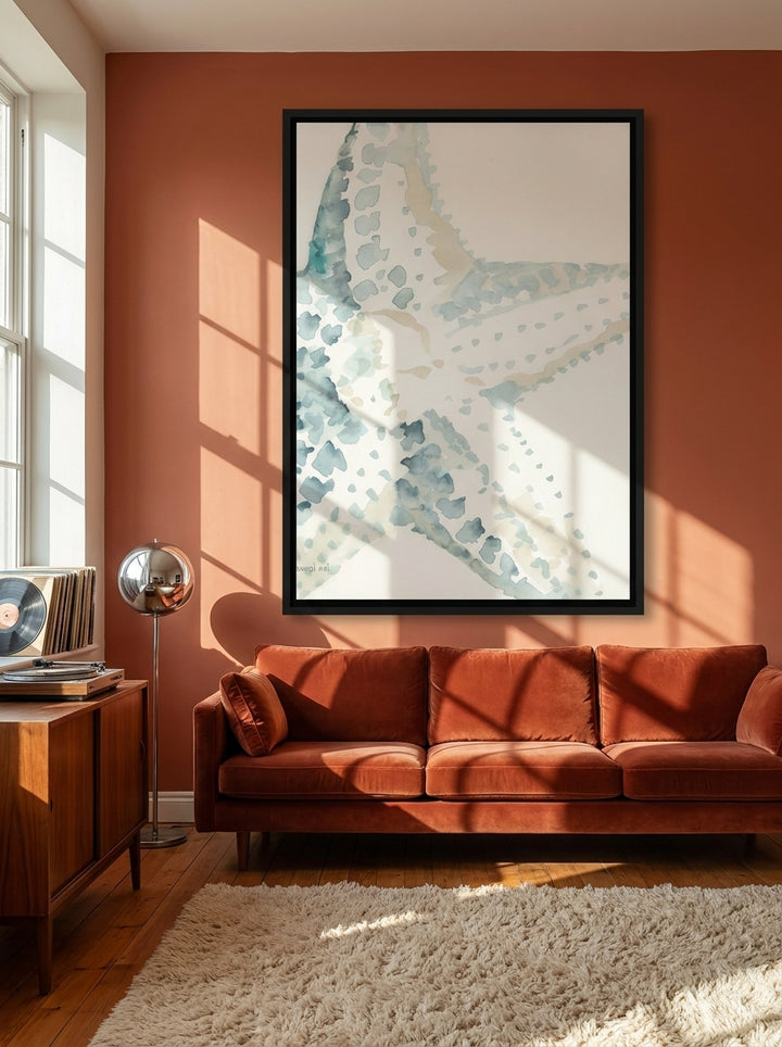 Oversized statement canvas wall art with a black surround styled on the wall in a retro 70s living room