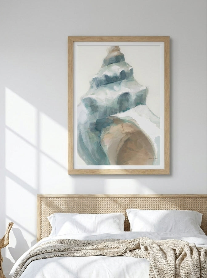 Modern wall art print styled on the wall in a coastal bedroom