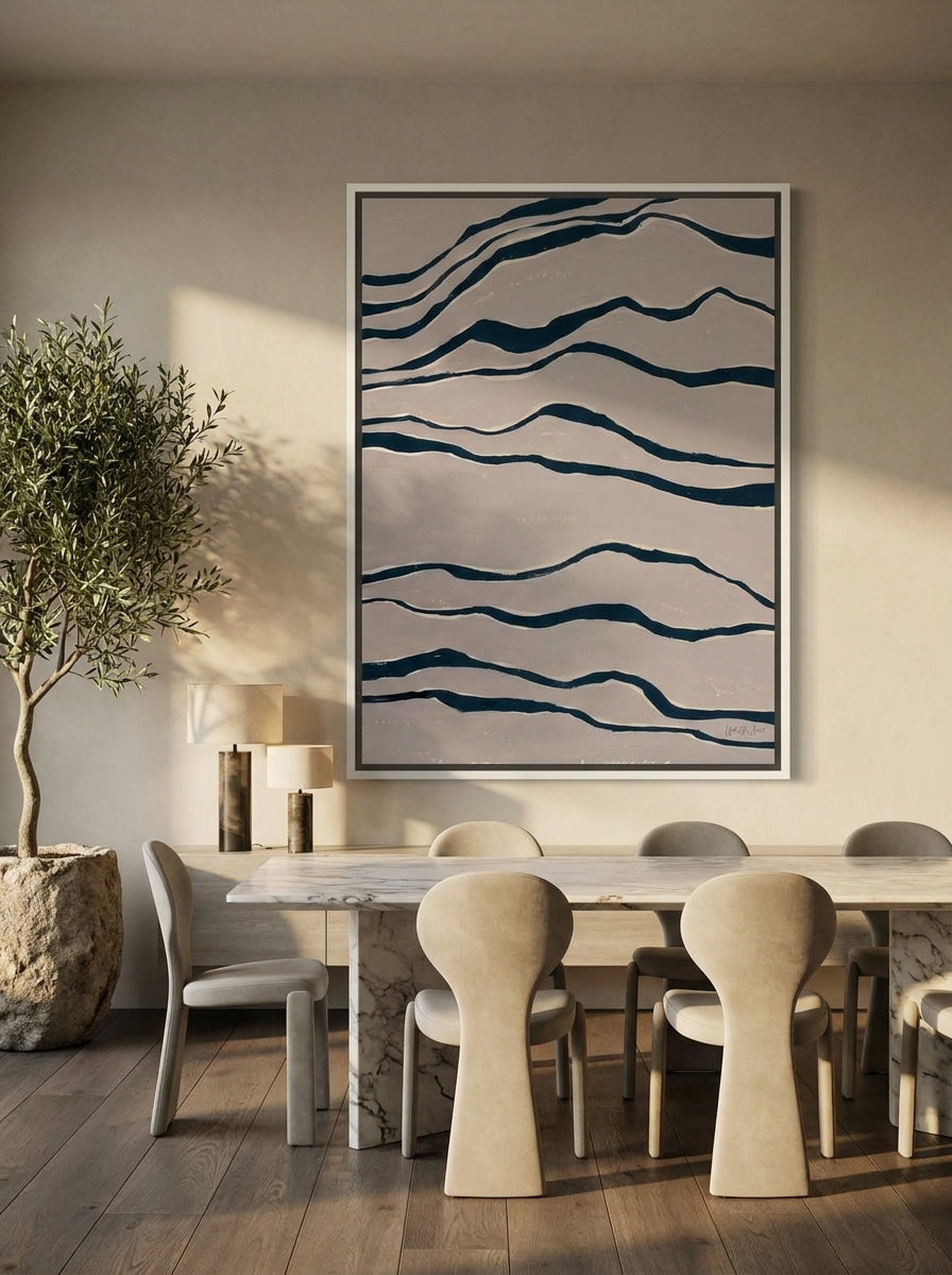 Canvas wall art with a white surround styled on the wall in a luxe dining room