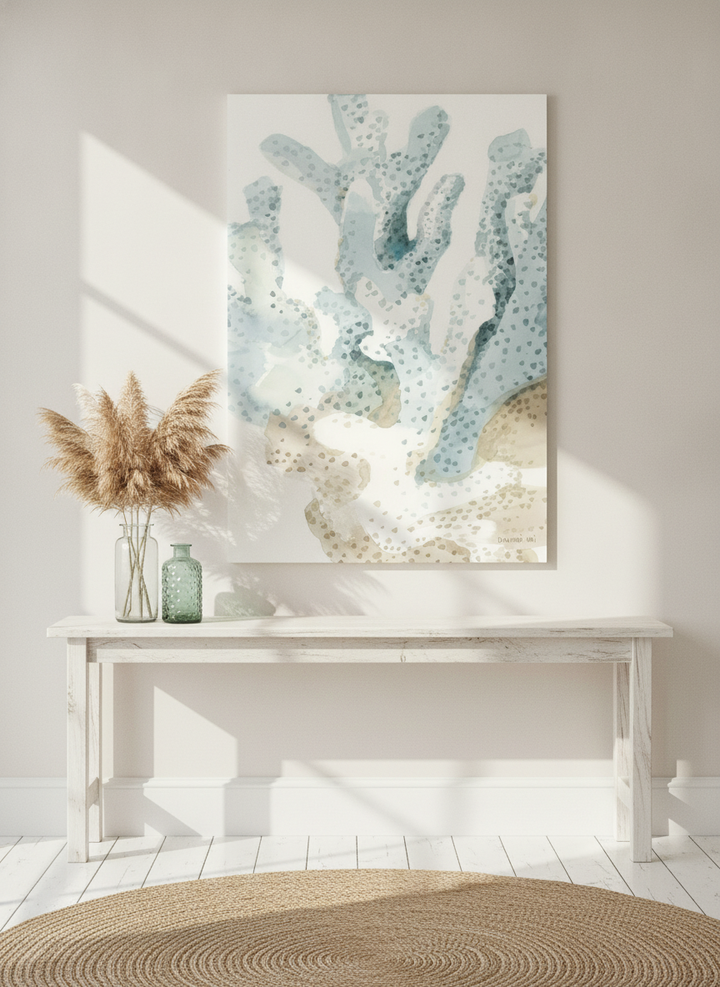 Stretched canvas wall art standing on a console in a coastal dining room