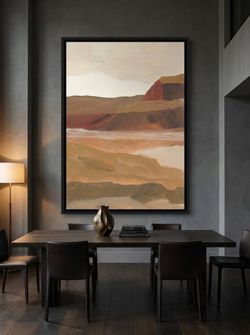 Oversized statement canvas wall art with a black surround styled on the wall in a moody dining room