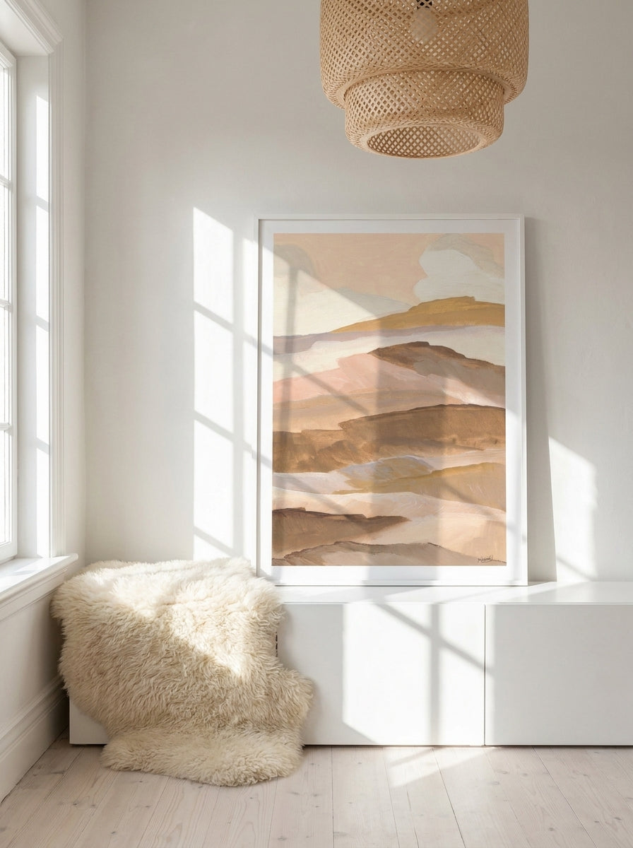 Modern wall art print standing on a sideboard in a bright Scandinavian home office