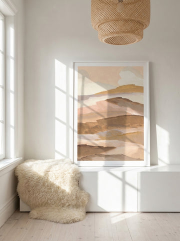 Modern wall art print standing on a sideboard in a bright Scandinavian home office