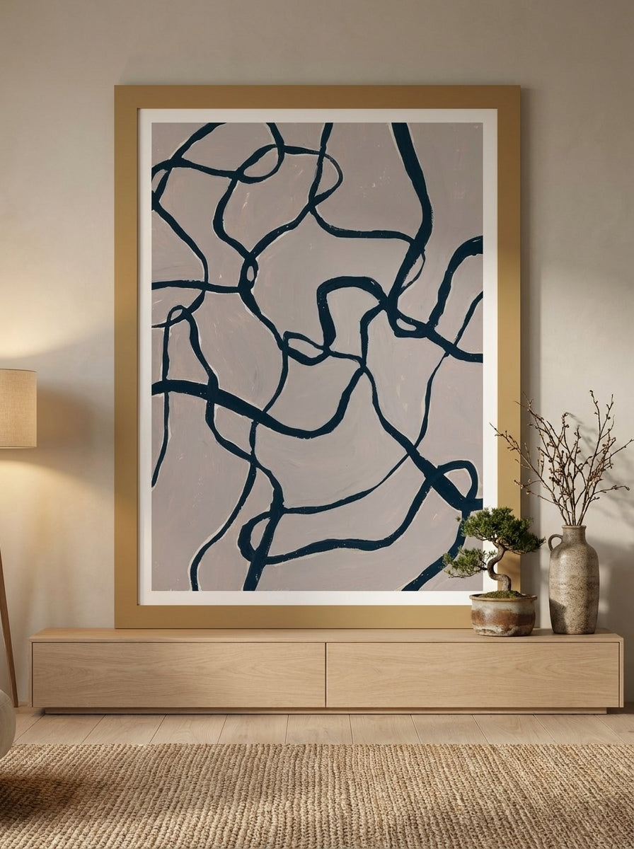 Modern wall art print styled on the wall in a warm Japandi living room