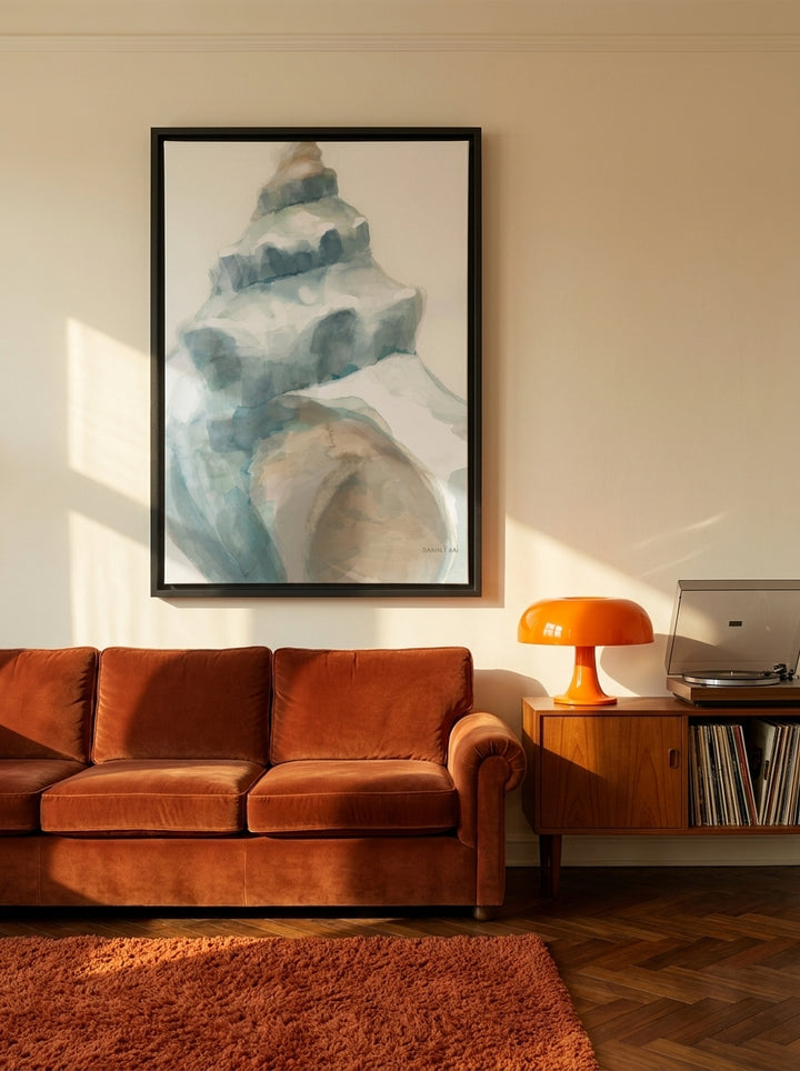 Oversized statement canvas wall art with a black surround styled on the wall in a retro 70s living room