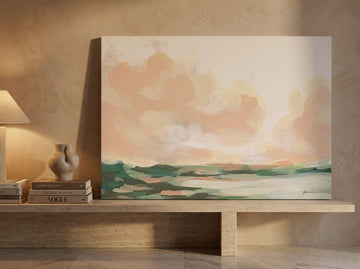 Stretched canvas wall art standing on a console in a luxe living room