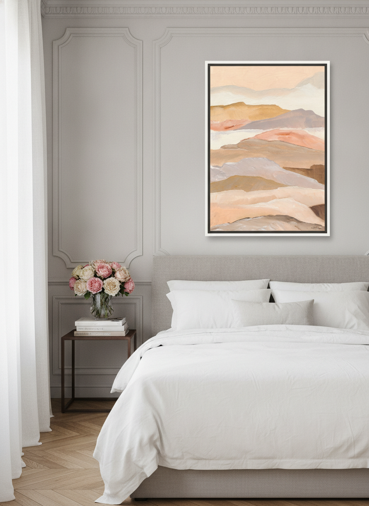 Canvas wall art with a white surround styled on the wall in a Parisian bedroom