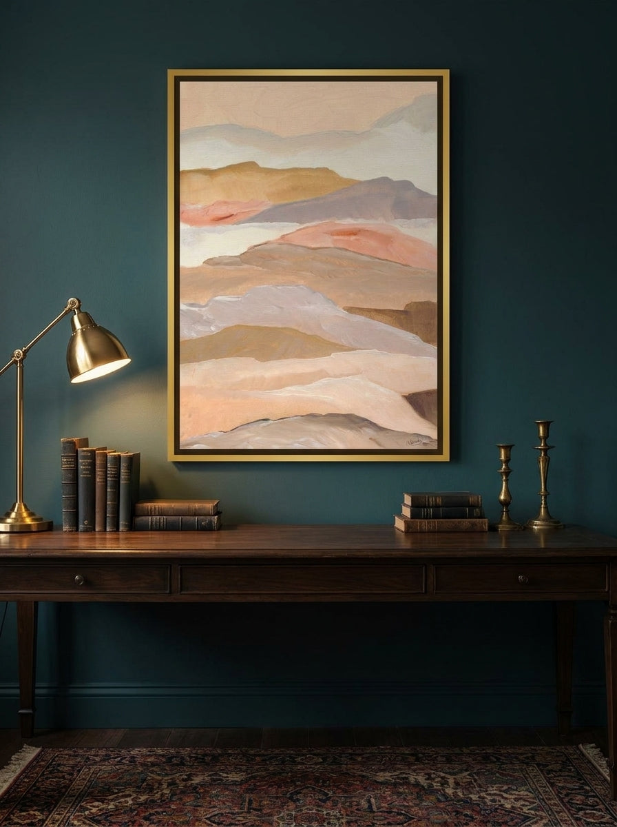 Canvas wall art with a gold leaf surround styled on the wall in a moody home office