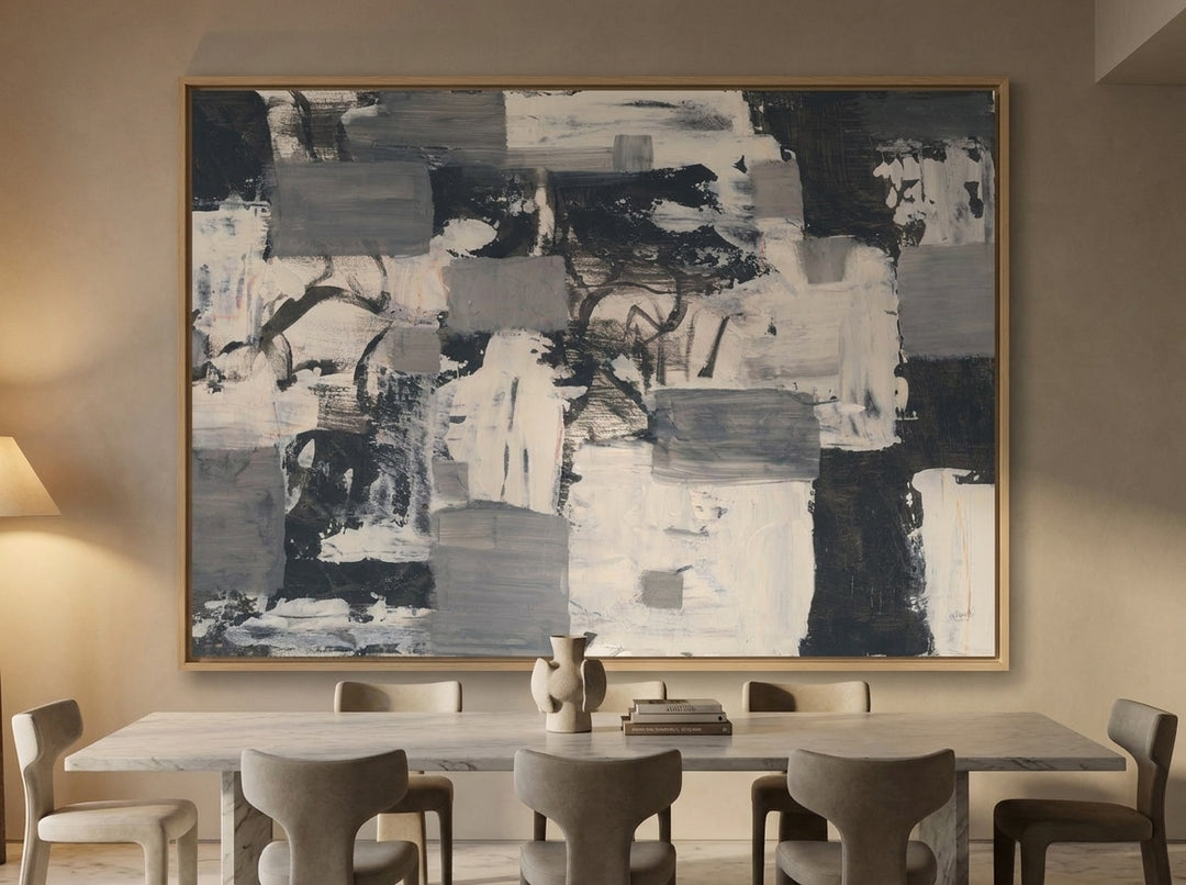 Oversized statement canvas wall art with a natural timber surround styled on the wall in a luxe dining room