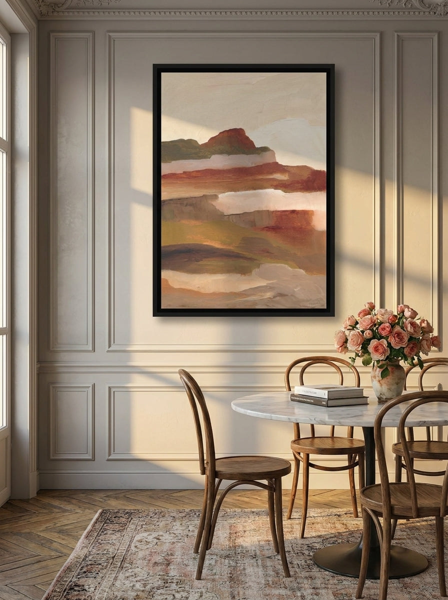 Oversized statement canvas wall art with a black surround styled on the wall in a Parisian dining room
