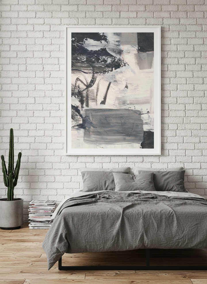 Modern wall art print styled on the wall in an industrial loft bedroom